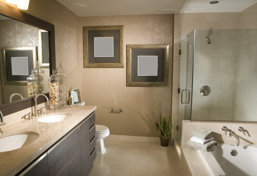 A large luxury bathroom with a glass walled, walk-in shower.