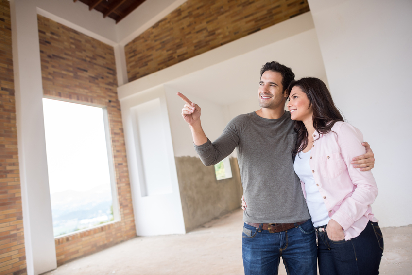 A couple touring a new construction home. 